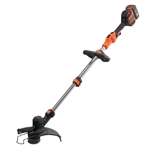 A BLACK+DECKER cordless grass trimmer with an orange and black design, featuring a straight shaft, auxiliary handle, and protective guard. The battery is attached at the end of the handle.
