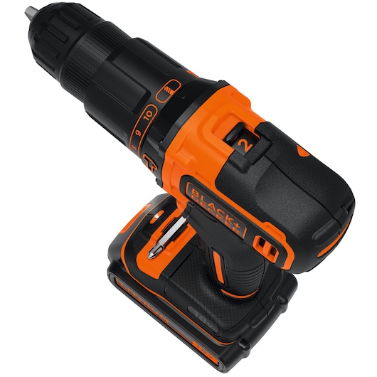 Cordless BLACK+DECKER power drill in black and orange color, showing the battery compartment and adjustable settings for drilling.