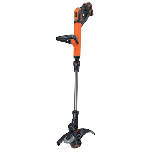 A BLACK+DECKER cordless grass trimmer with an orange and black body, adjustable handle, and battery pack. The device is upright and designed for lawn and garden maintenance.